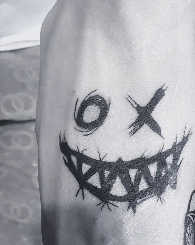 Blackwork tattoo by Sami Sami at S.Ink — grin, forearm