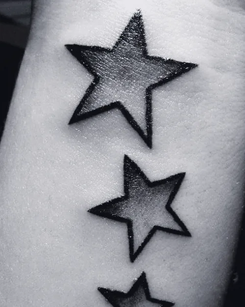 Blackwork tattoo by Sami Sami at S.Ink — stars, forearm